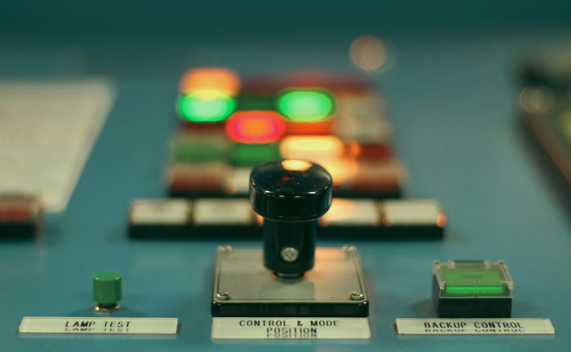 Control panel with a central mode selector and illuminated switches, illustrating separate access choices for AI crawlers